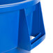 A blue plastic Carlisle Bronco recycling trash can with a handle.