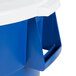 A blue and white Carlisle 44 gallon round recycling trash can with a white lid.
