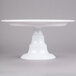 An Elite Global Solutions white melamine cake stand on a pedestal base.