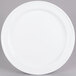 A white Elite Global Solutions melamine plate on a white plate stand.