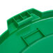 A green plastic lid for a Continental Huskee 44 gallon round trash can.