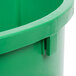 A green Continental Huskee 32 gallon round plastic bucket with a handle.