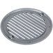 A round metal drain cover with a metal grate.