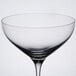 A close up of a Spiegelau cocktail glass with a rim.