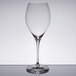 A clear Spiegelau Adina Prestige Bordeaux wine glass on a table.