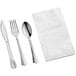 A white napkin with a Visions silver plastic cutlery set.