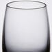 A close up of a clear Spiegelau Vino Grande shot glass with a black rim.