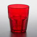 A red plastic tumbler on a table.