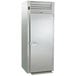 A large stainless steel Traulsen reach-in refrigerator with a solid door.