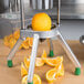 A Garde WEDGE10 fruit wedge cutter slicing an orange.