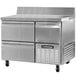 A stainless steel Continental Refrigerator worktop refrigerator with two drawers and one half door.