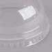 A clear plastic dome lid with a hole on top over a clear plastic container.