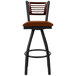 A BFM Seating metal bar stool with a light brown vinyl swivel seat.