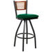 A BFM Seating bar stool with a green vinyl seat and black metal legs.