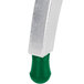 A silver and green rubber foot with a green bottom.