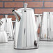 A close-up of a Vollrath stainless steel coffee pot.