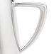 A Vollrath stainless steel creamer with a handle and lid.