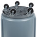 A Rubbermaid gray round trash can with wheels.