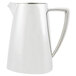A silver stainless steel pitcher with a handle.