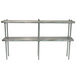 An Advance Tabco stainless steel double deck table mounted overshelves unit with metal legs.