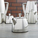 A group of Vollrath Triennium stainless steel teapots.