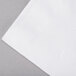 A close up of a Response white 2-ply dinner napkin.