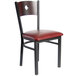 A BFM Seating black metal side chair with mahogany wood and a burgundy vinyl seat.
