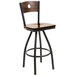 A BFM Seating bar height chair with a walnut wooden seat and black metal frame and back.
