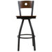 A BFM Seating black metal bar stool with a wood back and seat.