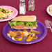A sandwich on a Creative Converting amethyst purple paper plate.