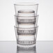 A stack of clear WNA Comet FunFusions plastic rocks glasses.