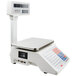 A white Cardinal Detecto digital price computing scale with tower display.