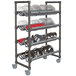 A Cambro Elements metal rack with trays and bowls on it.