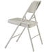 A gray National Public Seating metal folding chair.