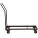 A black metal National Public Seating folding chair dolly with wheels and a handle.