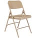A beige National Public Seating metal folding chair with a folding frame on a white background.