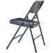 A black National Public Seating metal folding chair with a black seat.