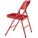 A red National Public Seating metal folding chair.