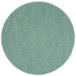 A green circular Scrubble burnishing pad.