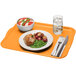 A Cambro rectangular tray with Tuscan Gold food and a bowl of salad on it.