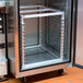 A Channel aluminum sheet pan rack inside a commercial oven.