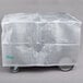 A translucent plastic covered box on wheels.