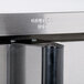 A close-up of a stainless steel corner and handle on a Garland deep depth convection oven.