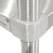 A close-up of a metal corner on an Advance Tabco stainless steel equipment stand.