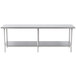 A long stainless steel Advance Tabco work table with an undershelf.