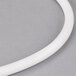 A white plastic tube with a white top gasket.