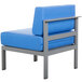 A soft gray BFM Seating aluminum outdoor chair with a blue cushion.