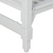 A white plastic Cambro Camshelving frame with 5 white vented shelves.