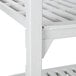 A white Cambro Camshelving unit with 4 vented shelves.