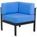 A blue chair with a black frame and armrest.